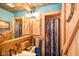 Rustic bathroom design with wooden cabinets, corrugated metal ceilings, and custom fixtures at 7714 Kenneth Ct, Brownsburg, IN 46112