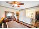 Spacious bedroom featuring a ceiling fan and a connecting bathroom view at 7714 Kenneth Ct, Brownsburg, IN 46112
