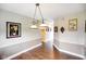 Charming dining room features hardwood floors and stylish two-tone walls at 7714 Kenneth Ct, Brownsburg, IN 46112