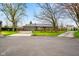 Brick home with manicured lawn, mature trees, and an inviting curb appeal at 7714 Kenneth Ct, Brownsburg, IN 46112