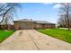 Charming brick home featuring a two-car garage, well-kept lawn, and welcoming curb appeal at 7714 Kenneth Ct, Brownsburg, IN 46112