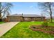 Charming one-story brick home with well-manicured lawn, mature trees, and a cozy feel at 7714 Kenneth Ct, Brownsburg, IN 46112