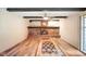 Spacious living room boasts a brick fireplace and hardwood floors at 7714 Kenneth Ct, Brownsburg, IN 46112