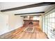 Cozy living room with fireplace, wood flooring, and natural light at 7714 Kenneth Ct, Brownsburg, IN 46112