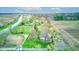 A sprawling residential lot features lush greenery complemented by mature trees and proximate farmland at 7764 S State Road 109, Markleville, IN 46056