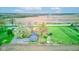 A birds-eye view of the property showcasing the home, detached garage, and expansive land at 7764 S State Road 109, Markleville, IN 46056
