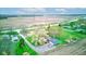 Aerial view of property highlighting the home, detached garage, and surrounding landscape at 7764 S State Road 109, Markleville, IN 46056