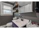 Bright bathroom with comfortable counter space, ample natural light, and neutral tones at 7764 S State Road 109, Markleville, IN 46056