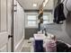 Comfortable bathroom with tub and shower combination, neutral walls, and dark vanity at 7764 S State Road 109, Markleville, IN 46056