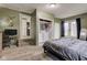 Spacious bedroom featuring laundry closet, access to back patio, and adjacent office space at 7764 S State Road 109, Markleville, IN 46056