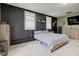 Bedroom with combination of dark and neutral paint, comfortable furniture, and bright natural light at 7764 S State Road 109, Markleville, IN 46056