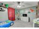 bedroom featuring comfortable carpet, dinosaur-themed decor, and plush carpeting at 7764 S State Road 109, Markleville, IN 46056