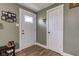 Inviting entryway featuring stylish floors, white trim and a view into the home at 7764 S State Road 109, Markleville, IN 46056