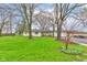 Quaint home with mature trees, a detached garage, and a well-manicured lawn at 7764 S State Road 109, Markleville, IN 46056