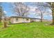 A charming single-story home with a detached garage and a spacious, grassy yard at 7764 S State Road 109, Markleville, IN 46056