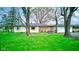 Charming one-story home with a detached garage and a beautiful, tree-filled yard at 7764 S State Road 109, Markleville, IN 46056