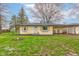 Charming single-story home with light yellow siding, a cozy porch, and inviting curb appeal at 7764 S State Road 109, Markleville, IN 46056