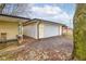 Spacious detached garage with gravel driveway and neutral siding, offering ample parking and storage at 7764 S State Road 109, Markleville, IN 46056