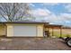 Detached two car garage with ample parking space and covered storage area at 7764 S State Road 109, Markleville, IN 46056