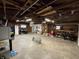 An expansive garage featuring open ceiling, abundant storage, and workspace with utility area at 7764 S State Road 109, Markleville, IN 46056