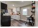 Well-lit kitchen featuring white cabinets, butcher block countertops, and space-saving pantry shelves at 7764 S State Road 109, Markleville, IN 46056