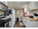 Kitchen showcasing butcher block counters and stylish white cabinetry with modern hardware at 7764 S State Road 109, Markleville, IN 46056