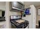 Kitchen featuring stainless steel appliances, modern countertops, and maximized pantry space at 7764 S State Road 109, Markleville, IN 46056