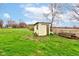 A backyard storage shed nestled in a spacious yard at 7764 S State Road 109, Markleville, IN 46056