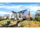 Beautiful backyard view with a stone retaining wall and a patio area at 8040 Lynch Ln, Indianapolis, IN 46250