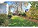 Expansive backyard with mature trees and a well-manicured lawn, perfect for outdoor activities at 8040 Lynch Ln, Indianapolis, IN 46250
