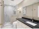 Well-lit bathroom features a marble shower and a granite-topped vanity with storage at 8040 Lynch Ln, Indianapolis, IN 46250