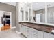 Bright bathroom with double vanity, granite countertops, and a spacious walk-in closet nearby at 8040 Lynch Ln, Indianapolis, IN 46250
