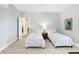 Bright and airy bedroom with two beds and a neutral color scheme for a serene ambiance at 8040 Lynch Ln, Indianapolis, IN 46250
