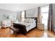 Elegant bedroom with hardwood floors, neutral walls, and stylish decor at 8040 Lynch Ln, Indianapolis, IN 46250