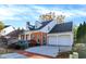 Lovely two-story brick home with an attached two-car garage and mature landscaping at 8040 Lynch Ln, Indianapolis, IN 46250