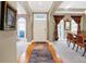 Elegant foyer with hardwood floors, columns, dining room, and lots of natural light at 8040 Lynch Ln, Indianapolis, IN 46250