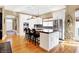 Bright kitchen with white cabinets, stainless steel appliances, and a center island at 8040 Lynch Ln, Indianapolis, IN 46250