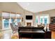 Spacious living room with fireplace and ample natural light, enhanced by comfortable seating arrangement at 8040 Lynch Ln, Indianapolis, IN 46250