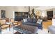 Open concept living room with adjacent dining area, featuring stylish seating and black built-in shelving at 8040 Lynch Ln, Indianapolis, IN 46250