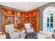 Charming living room featuring custom built-in shelving, creating an elegant and organized space at 8040 Lynch Ln, Indianapolis, IN 46250