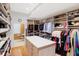 Well-organized walk-in closet with custom shelving and a center island for added convenience at 8040 Lynch Ln, Indianapolis, IN 46250