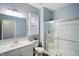 Bathroom features a new shower with sliding glass door, toilet, and vanity at 8160 Nik St, Brownsburg, IN 46112