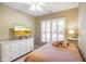 Comfortable bedroom with white furniture, a ceiling fan, and a twin bed with a charming decor at 8160 Nik St, Brownsburg, IN 46112