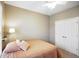 Neutral bedroom features light walls, double door closet, and a ceiling fan at 8160 Nik St, Brownsburg, IN 46112
