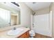 Bathroom featuring a vanity, mirror, tub, and shower with neutral color palette at 8424 Nuckols Ln, Indianapolis, IN 46237