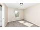 Bedroom features a bright window and neutral carpet, perfect for relaxation and comfort at 8424 Nuckols Ln, Indianapolis, IN 46237