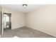 Bedroom with neutral paint, carpeting, and a doorway with a view to the upper level at 8424 Nuckols Ln, Indianapolis, IN 46237