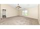 Large bedroom featuring new carpet, neutral colors, and a ceiling fan at 8424 Nuckols Ln, Indianapolis, IN 46237