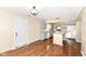 Well-lit kitchen featuring gray cabinets, granite countertops, a wood top kitchen island, and hardwood floors at 8424 Nuckols Ln, Indianapolis, IN 46237