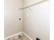 Laundry area with tile flooring, shelving, and washer hookups for added convenience at 8424 Nuckols Ln, Indianapolis, IN 46237